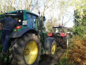 The two tractors needed to pull the barge.